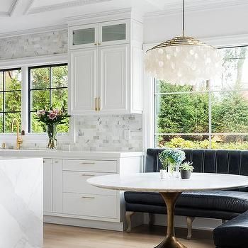 Restoration Hardware marble dining table in modern dining room